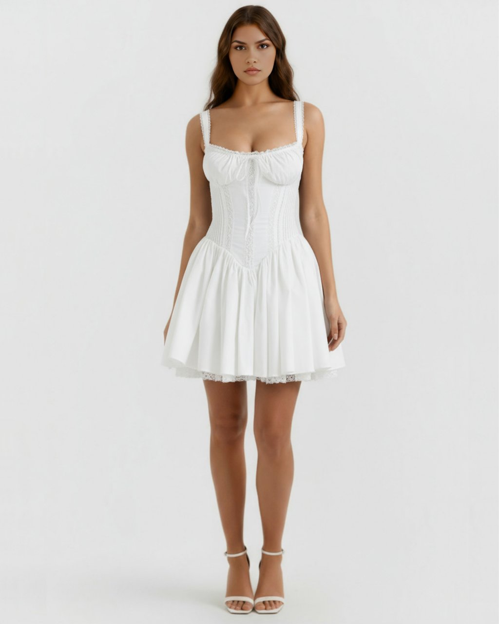 White corset-style mini dress with lace-trim spaghetti straps and ruffled hem