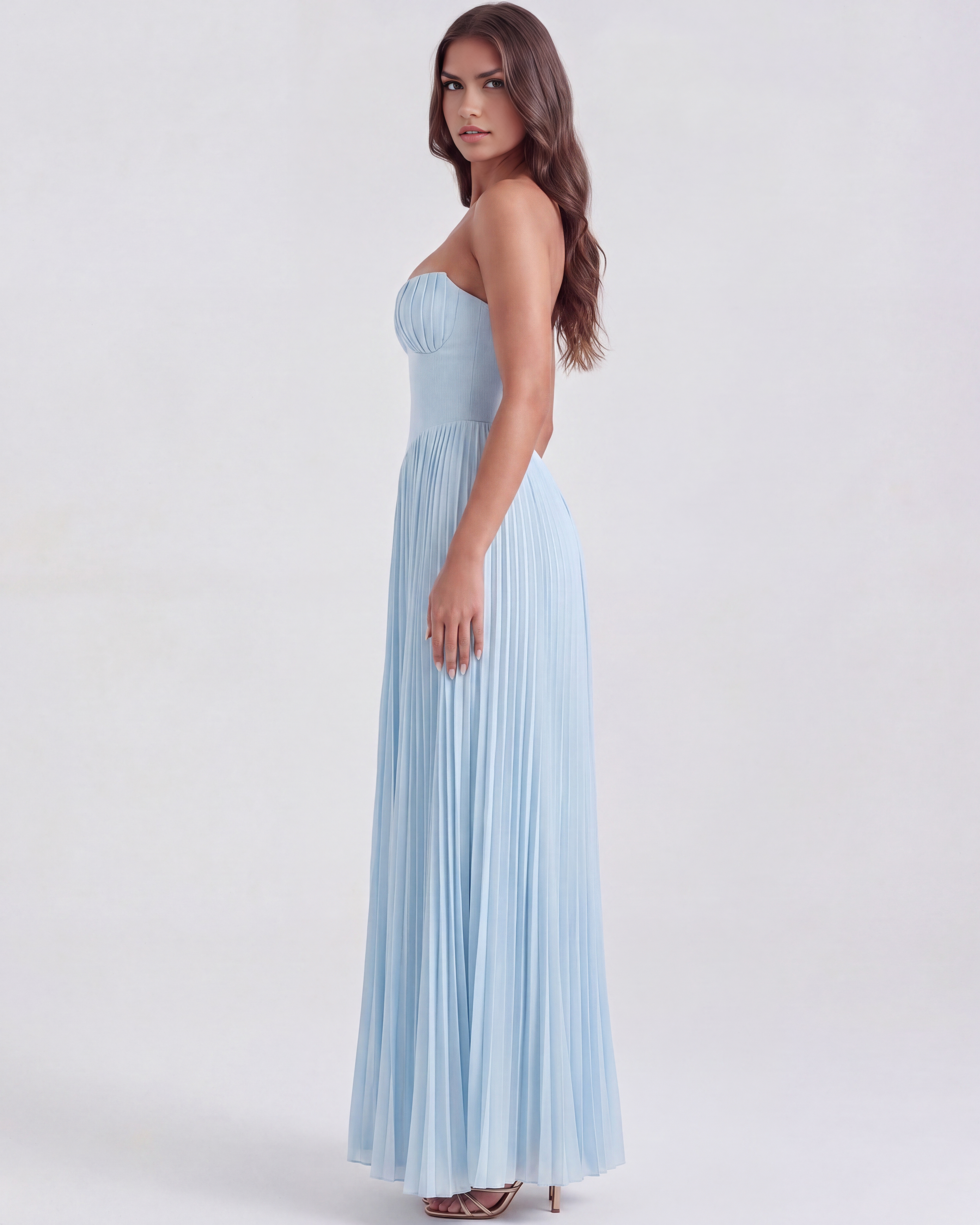 Side view of baby blue strapless pleated maxi dress with gathered waist