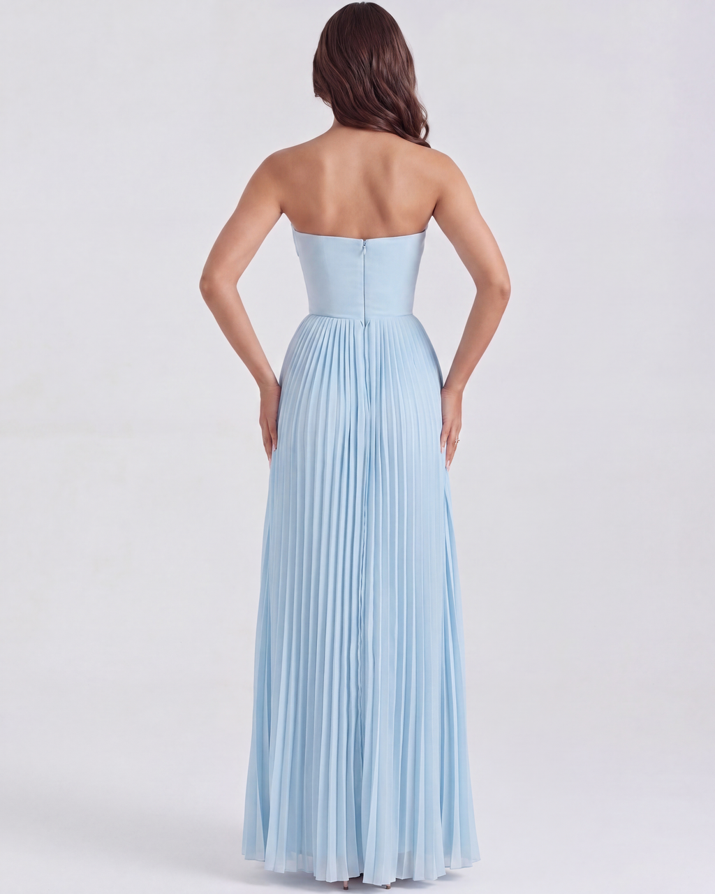 Back view of baby blue strapless pleated maxi dress with smooth fitted back